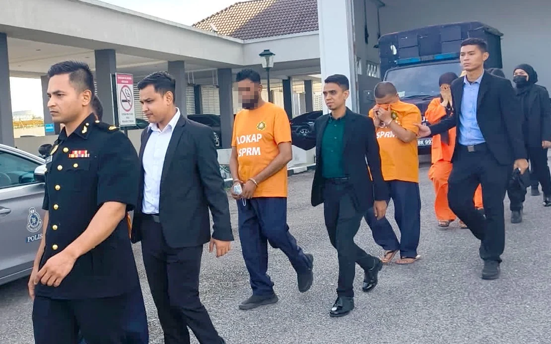 5 arrested in malaysia, including immigration officer
