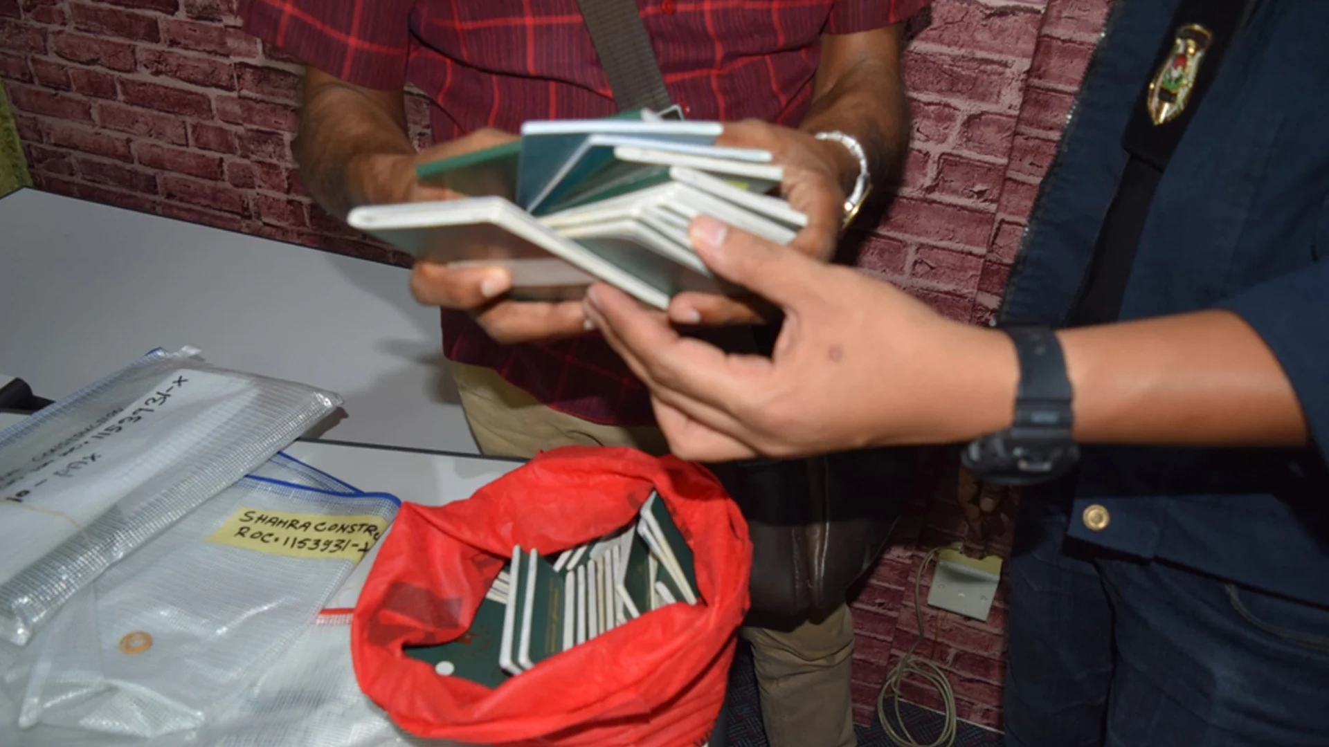 3 bangladeshis detained in malaysia with over 100 passports